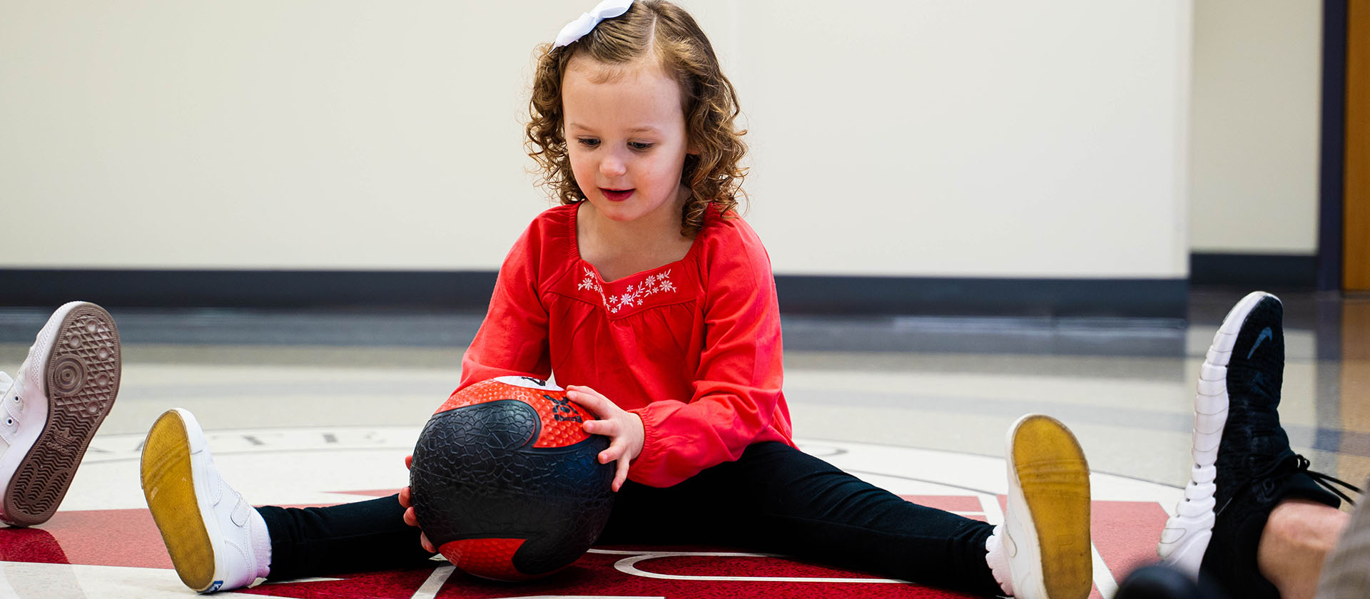 child working with a ball
